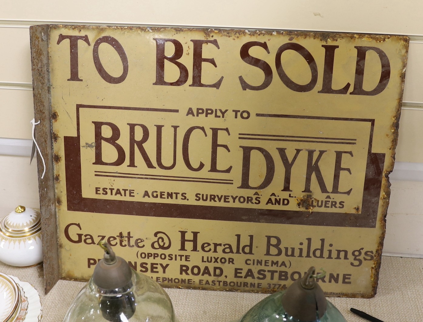 Eastbourne Interest - A ‘To be sold’ enamel sign - Bruce Dyke estate agents surveyors and valuers, 41cm high